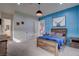 Stylish bedroom with a wood-framed bed, wood accents, and natural light at 6265 Iron Mountain Rd, Las Vegas, NV 89131