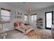 Charming bedroom features a comfortable bed, a stylish rug, and a whimsical decor at 6265 Iron Mountain Rd, Las Vegas, NV 89131