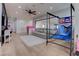 Inviting bonus room with hardwood floors, a comfortable seating area, and space for games and entertainment at 6265 Iron Mountain Rd, Las Vegas, NV 89131