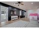 Spacious bonus room with hardwood floors, modern decor, and ample natural light, perfect for Gathering fun at 6265 Iron Mountain Rd, Las Vegas, NV 89131