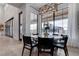 Inviting dining area with modern lighting, large windows, and easy access to the outdoor patio at 6265 Iron Mountain Rd, Las Vegas, NV 89131