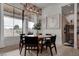 Dining room features hardwood floors and a view of the spacious backyard through expansive windows at 6265 Iron Mountain Rd, Las Vegas, NV 89131