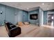 Entertainment room with large flat screen TV, beanbag seating, and sleek modern design at 6265 Iron Mountain Rd, Las Vegas, NV 89131