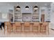 Modern kitchen featuring a kitchen island with barstool seating and open shelving at 6265 Iron Mountain Rd, Las Vegas, NV 89131