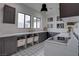 Bright laundry room featuring modern cabinets, decorative flooring, and a convenient folding area at 6265 Iron Mountain Rd, Las Vegas, NV 89131