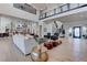 Expansive living room featuring hardwood floors, a modern staircase, and stylish furnishings at 6265 Iron Mountain Rd, Las Vegas, NV 89131