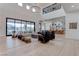 Spacious living room with hardwood floors, open to the kitchen and dining areas at 6265 Iron Mountain Rd, Las Vegas, NV 89131