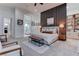 This main bedroom features modern furniture, a decorative accent wall, and an ensuite bathroom at 6265 Iron Mountain Rd, Las Vegas, NV 89131