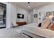 Bright main bedroom featuring a large bed, modern furniture, and a sliding glass door to the outside at 6265 Iron Mountain Rd, Las Vegas, NV 89131
