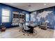 Bright office with large desk, built-in shelves, light hardwood floors, and a blue world map mural at 6265 Iron Mountain Rd, Las Vegas, NV 89131