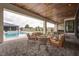 Serene outdoor living space with comfortable seating and a view of the sparkling pool at 6265 Iron Mountain Rd, Las Vegas, NV 89131