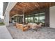 Elegant outdoor living area with a stylish lounge area on a paved surface at 6265 Iron Mountain Rd, Las Vegas, NV 89131
