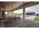 Inviting outdoor space featuring dining and lounge areas adjacent to the sparkling pool at 6265 Iron Mountain Rd, Las Vegas, NV 89131