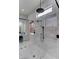 This bathroom features a glass walk-in shower, modern fixtures, and tile floors at 6265 Iron Mountain Rd, Las Vegas, NV 89131