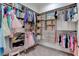 Organized walk-in closet with custom shelves and hanging racks for clothes and accessories at 6265 Iron Mountain Rd, Las Vegas, NV 89131