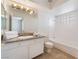Bathroom with granite countertops, a bathtub, shower, and natural light at 6808 Elm Creek Dr # 203, Las Vegas, NV 89108