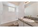 Bathroom with granite countertops and a bathtub with shower at 6808 Elm Creek Dr # 203, Las Vegas, NV 89108