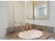Bathroom featuring granite countertops, mirrored medicine cabinet, and brushed gold faucet at 6808 Elm Creek Dr # 203, Las Vegas, NV 89108