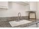Close up of kitchen sink with granite countertop at 6808 Elm Creek Dr # 203, Las Vegas, NV 89108