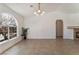 Bright living room featuring tile floors, arched window, and decorative fireplace at 6808 Elm Creek Dr # 203, Las Vegas, NV 89108