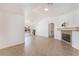 Spacious living room with natural light, tile flooring, and a cozy fireplace at 6808 Elm Creek Dr # 203, Las Vegas, NV 89108
