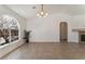 Bright living room featuring tile floors, arched window, and decorative fireplace at 6808 Elm Creek Dr # 203, Las Vegas, NV 89108