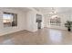 Living space with tile floors, plenty of natural light, and an open view of the kitchen at 6808 Elm Creek Dr # 203, Las Vegas, NV 89108