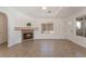 Bright living room featuring tile floors, neutral walls, a fireplace, and plenty of natural light at 6808 Elm Creek Dr # 203, Las Vegas, NV 89108