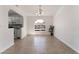 Bright living room featuring tile floors, arched window, and easy kitchen access at 6808 Elm Creek Dr # 203, Las Vegas, NV 89108