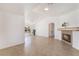 Spacious living room with tile flooring, a fireplace, and large window for natural light at 6808 Elm Creek Dr # 203, Las Vegas, NV 89108