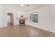 Bright living room featuring tile floors, a fireplace, and a large window at 6808 Elm Creek Dr # 203, Las Vegas, NV 89108