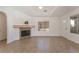 Bright living room featuring a fireplace, tile flooring, and natural light from the large windows at 6808 Elm Creek Dr # 203, Las Vegas, NV 89108