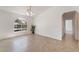 Bright living room featuring tile floors, arched window, and recessed lighting at 6808 Elm Creek Dr # 203, Las Vegas, NV 89108