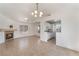 Open living space featuring tile flooring, fireplace, and an adjacent kitchen at 6808 Elm Creek Dr # 203, Las Vegas, NV 89108