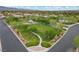 Aerial view highlighting a community park with open green space, a gazebo, and sidewalks at 7288 Olsen Farm St, Las Vegas, NV 89131