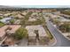 Aerial view of a single-Gathering home showcasing a well-maintained roof, desert landscaping, and a paved driveway in a suburban community at 7288 Olsen Farm St, Las Vegas, NV 89131