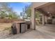 Backyard with an outdoor kitchen island with built in refrigerator, grill and lots of counter space at 7288 Olsen Farm St, Las Vegas, NV 89131