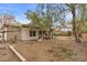 Spacious backyard with natural desert landscaping offers privacy and room for outdoor activities at 7288 Olsen Farm St, Las Vegas, NV 89131
