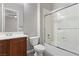 Bathroom with a sliding glass shower door, vanity, and toilet at 7288 Olsen Farm St, Las Vegas, NV 89131