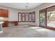 Dining area features plantation shutters and seamless access to outdoor living space at 7288 Olsen Farm St, Las Vegas, NV 89131