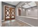 Elegant entrance featuring decorative double doors, tile flooring, and recessed lighting at 7288 Olsen Farm St, Las Vegas, NV 89131