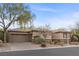 Charming single-story home featuring desert landscaping, stone accents, and a two-car garage at 7288 Olsen Farm St, Las Vegas, NV 89131