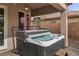Relax in the backyard hot tub with a cover, offering a private outdoor oasis at 7288 Olsen Farm St, Las Vegas, NV 89131