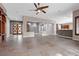 Open-concept living space featuring tile floors and large windows at 7288 Olsen Farm St, Las Vegas, NV 89131