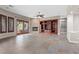 Open living room with custom media built-ins, fireplace and sliding doors to the outdoor patio at 7288 Olsen Farm St, Las Vegas, NV 89131