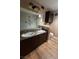 Bathroom features dual sinks, modern fixtures, and a large mirror at 7904 Greycrest Ct # 104, Las Vegas, NV 89145
