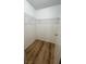 Walk-in closet with wire shelving and wood-look floors at 7904 Greycrest Ct # 104, Las Vegas, NV 89145