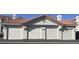 Row of garages with individual doors, offering ample parking and storage space for residents at 7904 Greycrest Ct # 104, Las Vegas, NV 89145