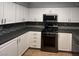 Bright kitchen featuring sleek stainless steel appliances, tiled backsplash, and plenty of white cabinet storage at 7904 Greycrest Ct # 104, Las Vegas, NV 89145