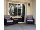 Cozy patio with outdoor seating and a sliding glass door for easy access to the interior at 7904 Greycrest Ct # 104, Las Vegas, NV 89145